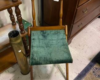 One of two antique campaign chairs