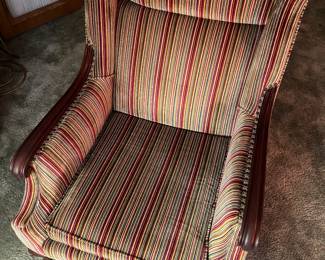Vintage upholstered armchair with cool retro fabric.