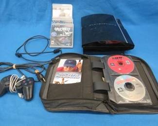 Lot 232. PlayStation 3 console, controller, cords, and 37 games