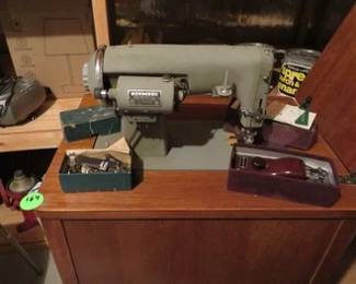Lot 164. Kenmore sewing machine with attachments. Cabinet is 24"W x 31"H x 18"D