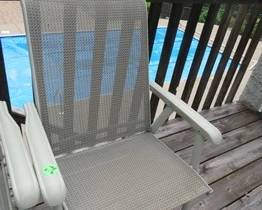 Lot 199. Three patio chairs and a side table