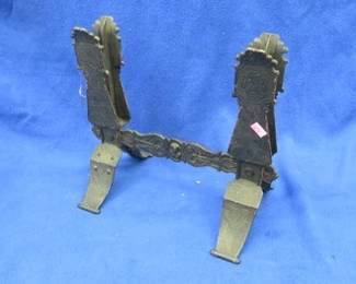 Lot 230. Old metal stand with an unknown purpose plus two bow saws