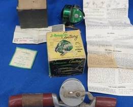 Lot 207. Johnson Century Model 100 reel in the box with papers and a Horrocks-Ibbotson baitcasting reel and J.C. Higgins rod handle