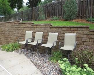 Lot 221. Four high-top patio chairs