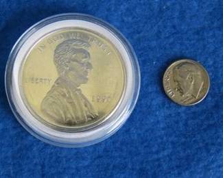 Lot 179. One Golden State Mint? .999 pure troy ounce silver Lincoln Penny bullion round weighing approx. 31.1 grams
