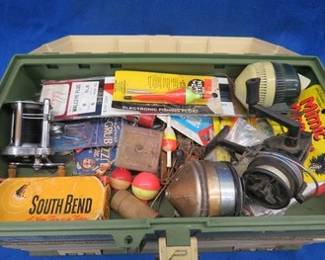 Lot 203. #707 Plano tackle box with old tackle including an empty South Bend Bass-Oreno box, a Pflueger Akron baitcasting reel, and more.