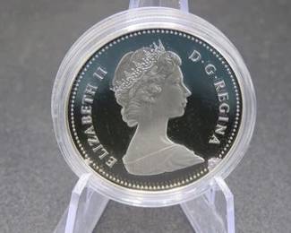 Lot 61. 1984 Canadian Proof 50% Silver Dollar with total weight of 23.3276 grams