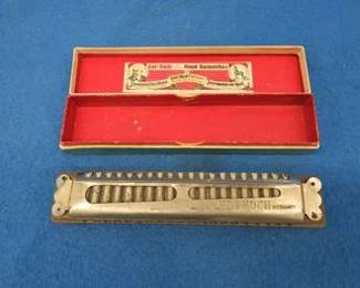 Lot 87. Andy Koch 20-hole tremolo harmonium concert harmonica in the key of D. Sounds great. Box is in excellent condition.