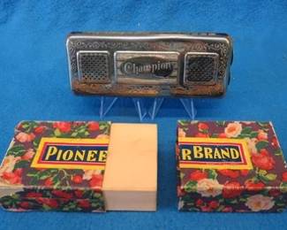 Lot 80. Pioneer Brand Champion double-sided tremolo harmonica in the key of C and G. A couple reeds need tuning. Box is in great condition.