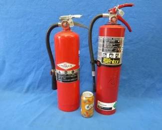 Lot 48. Two ABC fire extinguishers. Both feel full.