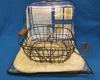 Lot 206. Sheepskin car seat cover (new), potato basket, and a homemade towel rack