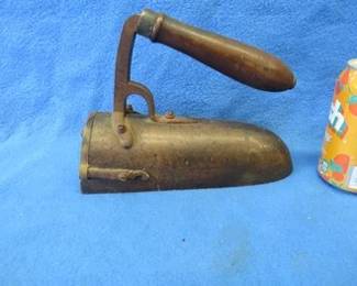 Lot 82. Wooden-handled antique iron made of mostly brass