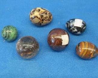 Lot 291. Polished rocks. One may be glass.