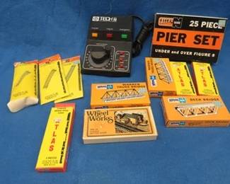 Lot 299. N gauge track, bridge piers, truss bridges, Tech II Railmaster 2400 control unit, and more