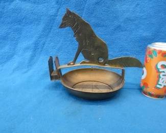 Lot 29. Ges Gesch cigar tip cutter. Made of brass and depicting a dog or wolf. Good working condition.