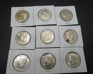 Lot 100. Nine 40% silver Kennedy half dollars