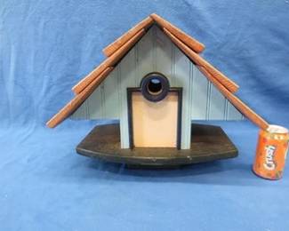 Lot 330. Pretty dang nice well-built birdhouse. Mounts on a 4 x 4 pole.