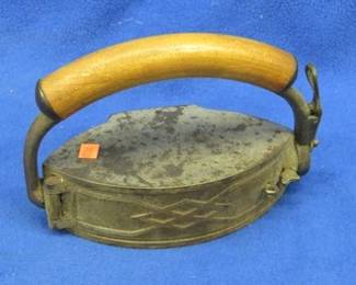Lot 268. Vintage sad iron with a compartment for embers