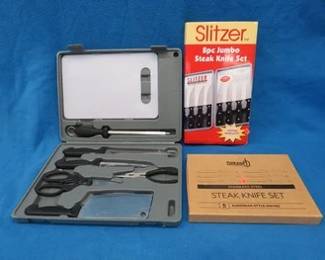 Lot 183. Two sets of Slitzer steak knives and a Maxam kitchen set. All are new-in-the-box.