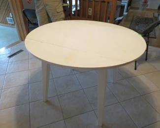 Lot 132. Round drop-leaf table 42" diameter. Folded 25"x 42"