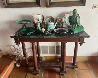 Assorted Majolica pieces. Green marble table is 41.5W x 31T.