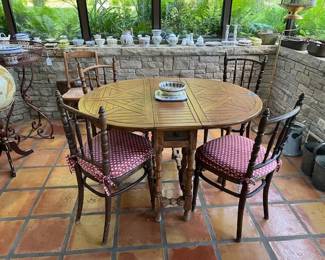 Antique base drop leaf table with parque' top and 4 chairs.