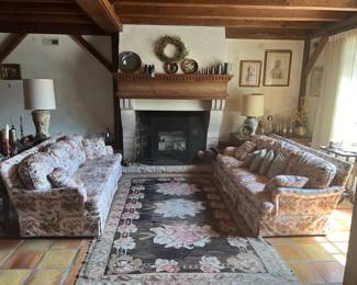 2-86", 3-cushion sofa's. French country print, pink and brown fabric, white background. Horses and dogs. Kilim rug and pad 10' x 6'
