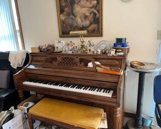piano and bench containing music