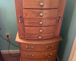 4 ft tall jewelry chest. 8 drawers