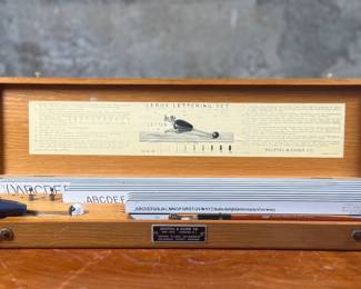 This lot features a vintage Keuffel & Esser (K&E) Leroy lettering set. Appears to be complete in the box.