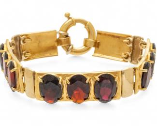 Lot 23
18K Yellow Gold And Oval Cut Garnet Link Bracelet L 6" 30 g 1 PC