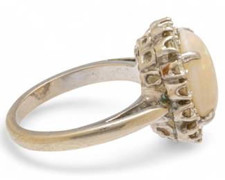 Lot 83
Opal, Diamond, And 14k White Gold Ring 6.5 6 g
