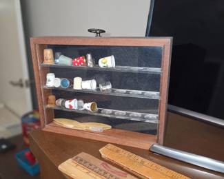 miniature display case -collection of thimbles