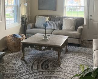 Couch, area rug, curtains, art table, pillows, everything must go