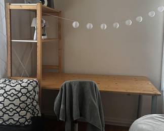 Desk, pillows, lights, book ends, storage chest