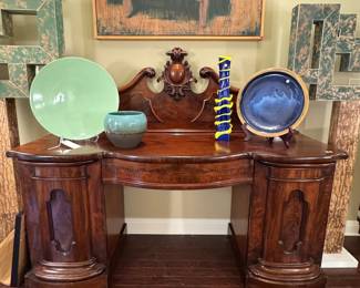 Elegant renaissance revival carved mahogany sideboard server. Single center drawer and two columnar cabinet doors with fitted interior. 