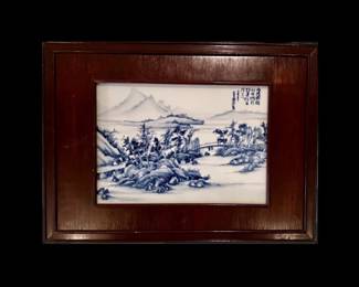 Blue and White rectangular porcelain plaque painted in underglaze blue to depict a mountainous landscape, mounted within a hardwood frame