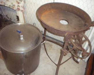 Large pot with spigot and lid and part of a forge