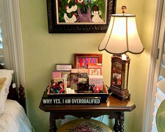 Pretty collection of folk art, sweet little Eastlake side table, needlepointed stool, and unique lamp
