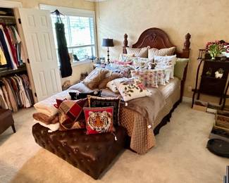 Decorative and needlepoint pillows, lovely tufted leather bench and pretty bedroom set 