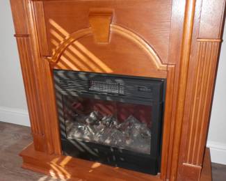 Electric fireplace / can radiate heat and displays mood of fire.