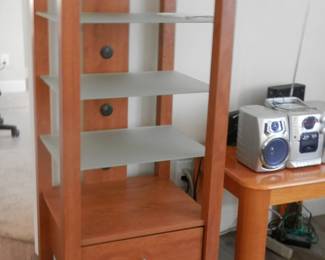 "Sauder" etegere with 3 frosted glass shelves, also one on the top and drawer in bottom....holes along back for cords and cables.... Have 2 of these !!
