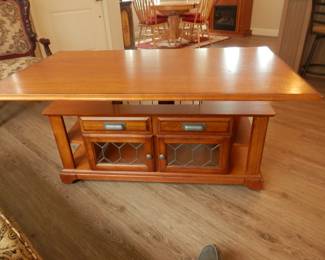 Coffee table with top raised...table is mounted on smooth rolling wheels