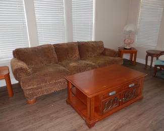 8 foot contemporary sofa Chenille upholstery....Oak coffee table on wheels with top that raises for writing or dining and leaded glass doors !