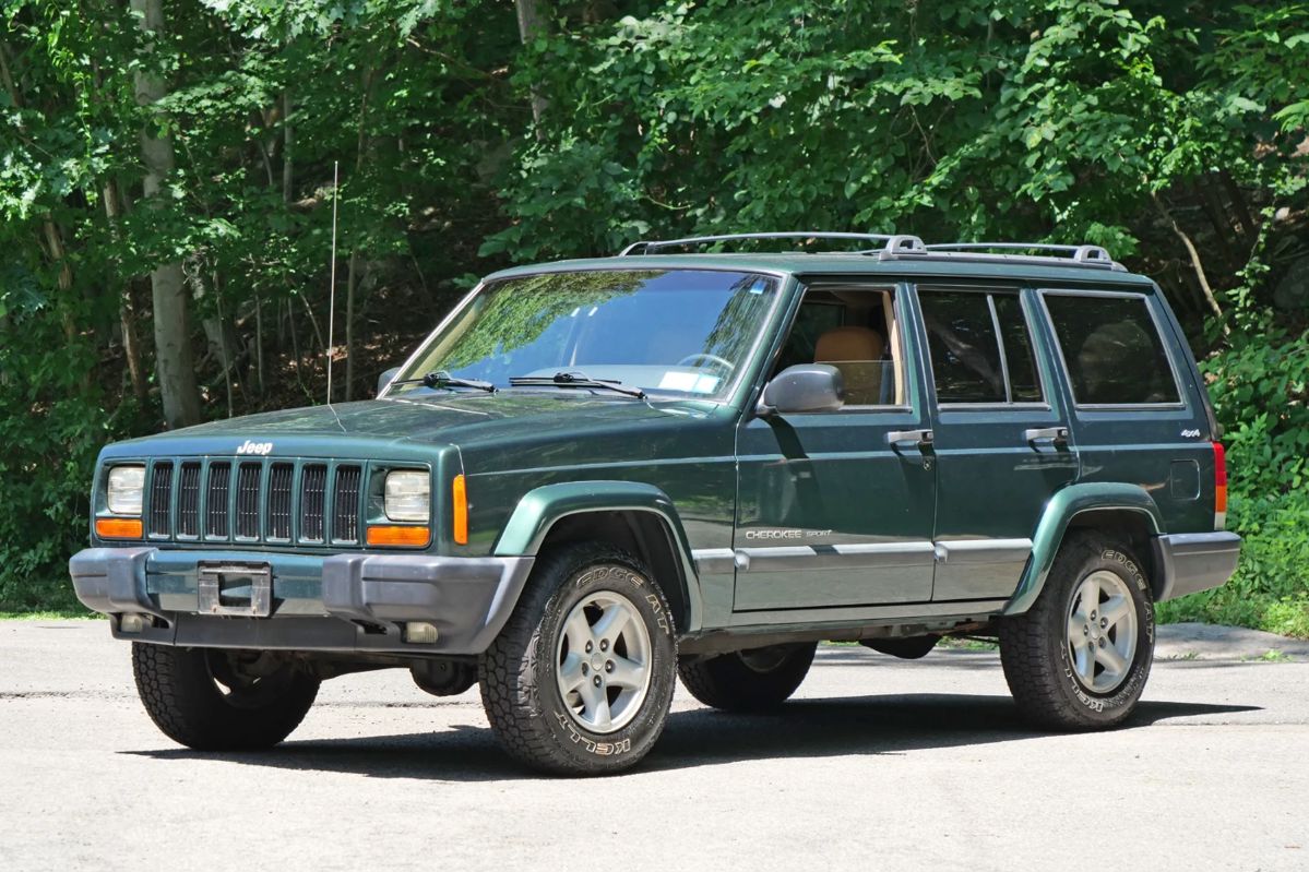 2000 JEEP CHEROKEE SPORT 4x4 / LEATHER / SINGLE OWNER / 75k ORIGINAL MILES | 74,675 original miles, one owner, clean carfax!
VIN: 1J4FF48S8YL231397. Purchased new from Biltmore Motors in Rye, NY c. 2000 - always garaged in an important Scarsdale, NY home.
All service records from 25 years of ownership. Forest Green Pearl paint and Camel brown leather interior.
Original window sticker describes Sport Value Group optional equipment:
Air Conditioning
Power Windows, Locks, Mirrors
Keyless Entry
Leather wrapped wheel
plus anti lock brakes, automatic transmission, factory tinted rear windows, fog lamps, cruise (speed) control, full size spare, 15 in. aluminum rims, only aftermarket add is a cd-changer under the rear seat.