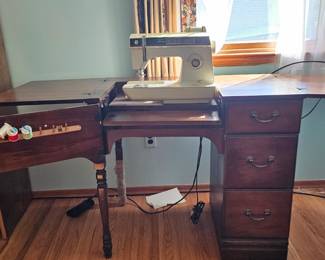 Sewing machine in cabinet.