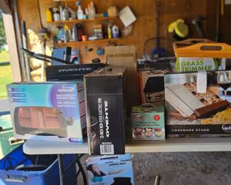 Many unused, unopened small appliances.