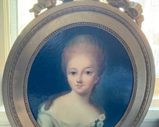 Antique Oil on canvas portrait of a young woman in a gilded oval ribbon frame