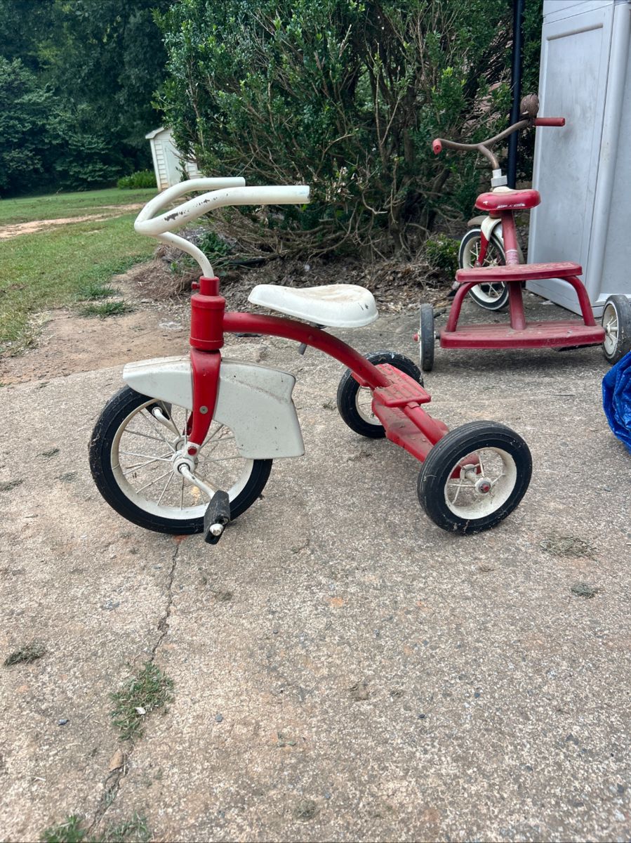Antique AMC Tricycle. Metalwork is in good shape and tricycle “works”. Our father bought at an auction sale and had it redone around 2005. It has been stored in building since that time.