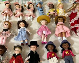 Collection of Madame Alexander Happy Meal toys from various years.